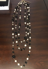 Load image into Gallery viewer, RARE Chanel 100th Anniversary 2010 Cruise 10C Black White Gold Pearl Coco Figure Sautoir 3 Strand Long Necklace
